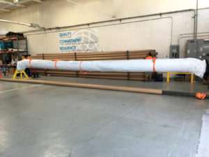 Photo F: Finished panel, rolled up and packaged. 7,875 square feet per roll / 3,800 lbs. per roll. Photo courtesy of Colorado Lining.