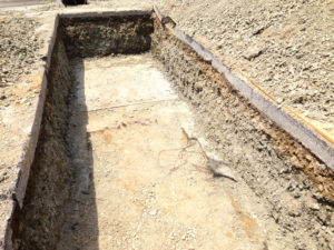 Photo: Test pit excavation down to the geotextile layer.