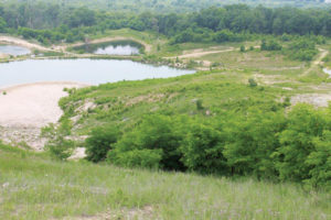 View of the quarry site with vegetated slopes.