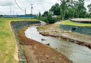 Completed geocell walls offer protection to an area of the watershed prone to flash flooding.