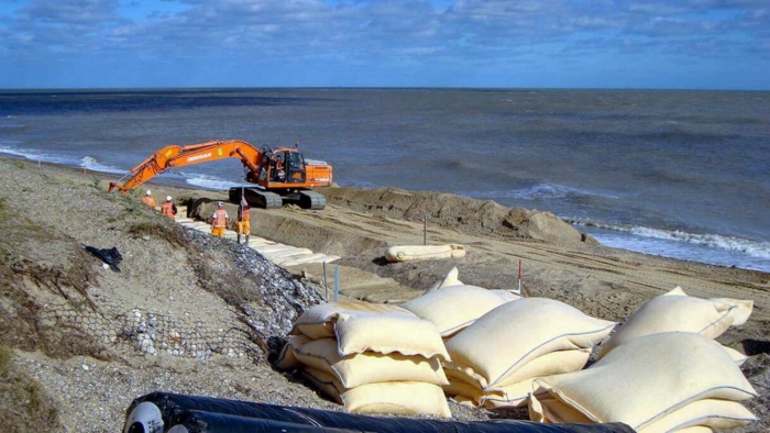 Installing geotextile bags on beach at Thorpeness, England, for coastal protection with geosynthetics